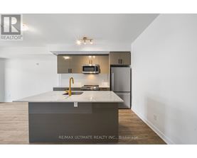 A modern kitchen with a large island in the middle.