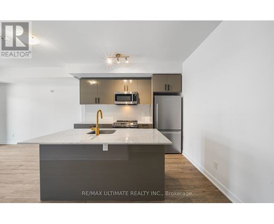 A modern kitchen with a large island in the middle.