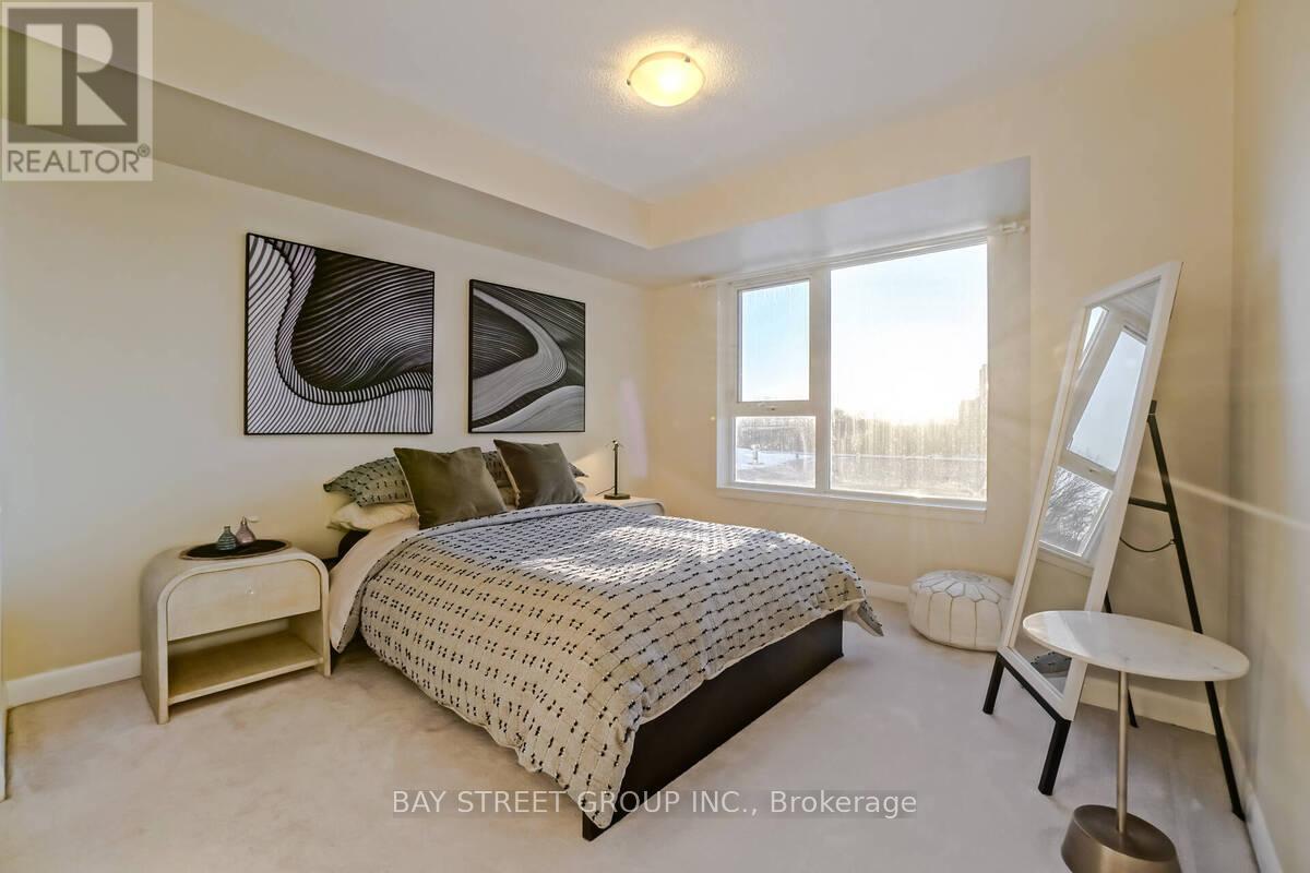 A bedroom with a bed, nightstand, and chair.