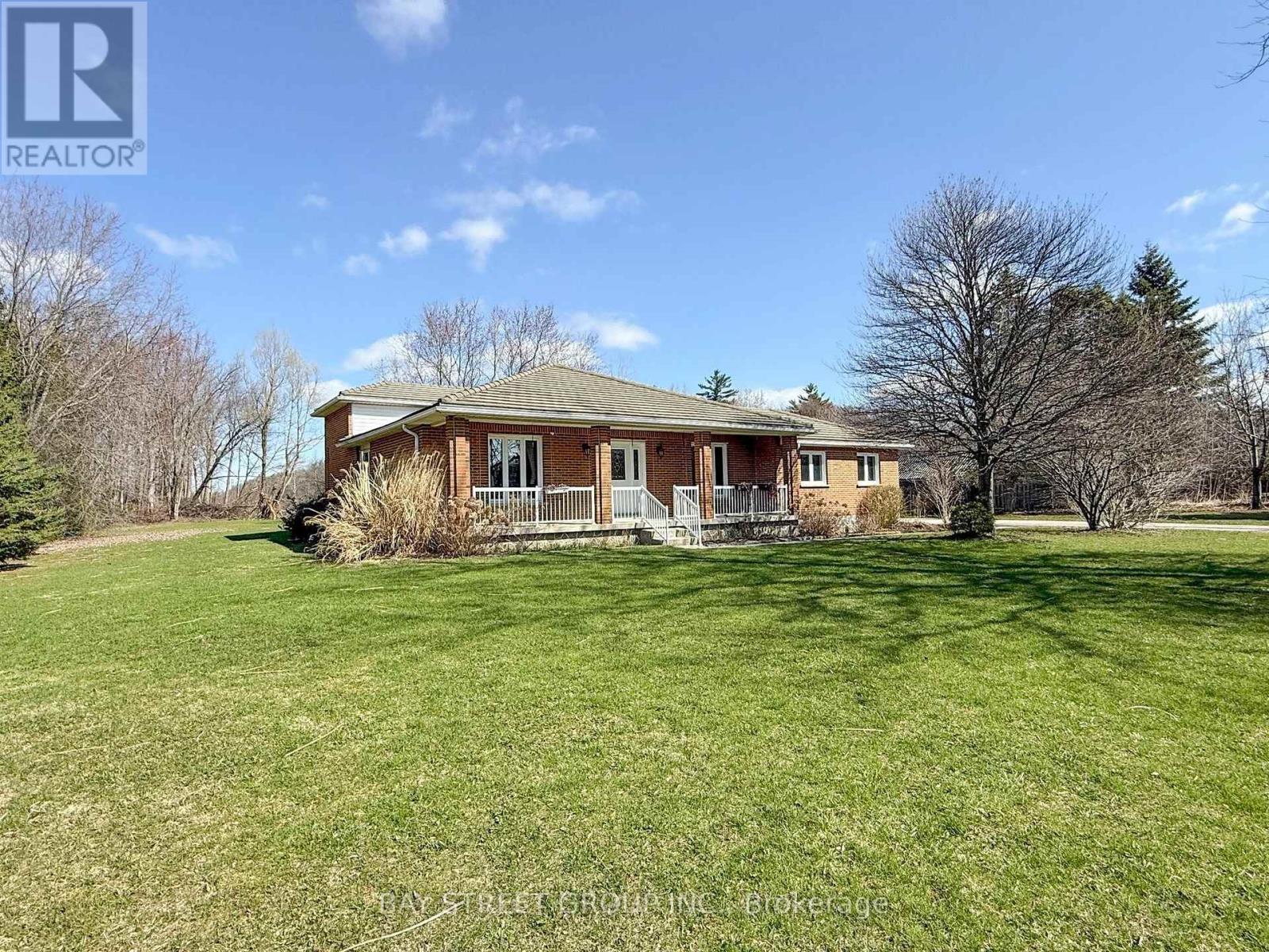 A house with a lawn in front of it.