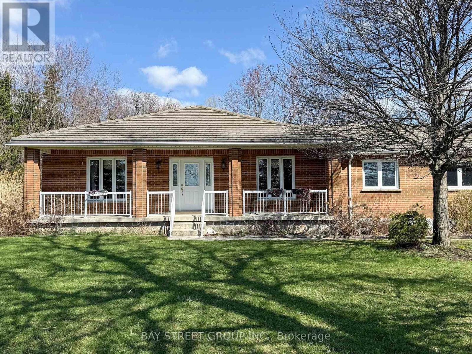 A house with a lawn in front of it.
