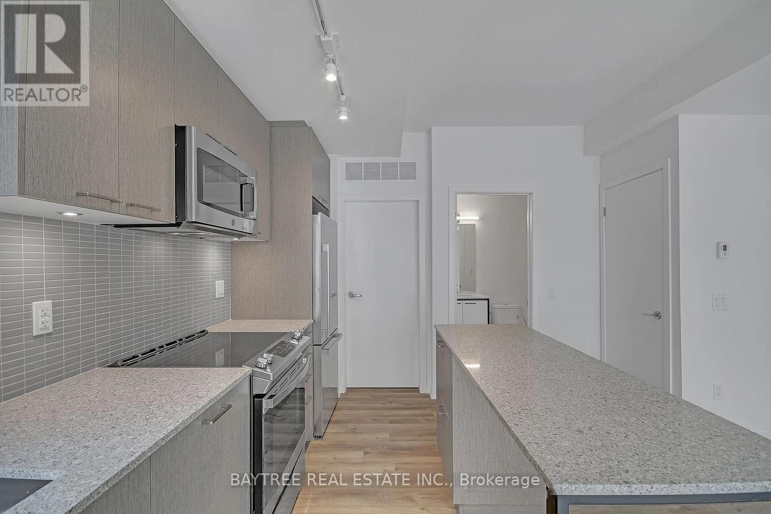 A modern kitchen with a microwave above the stove.