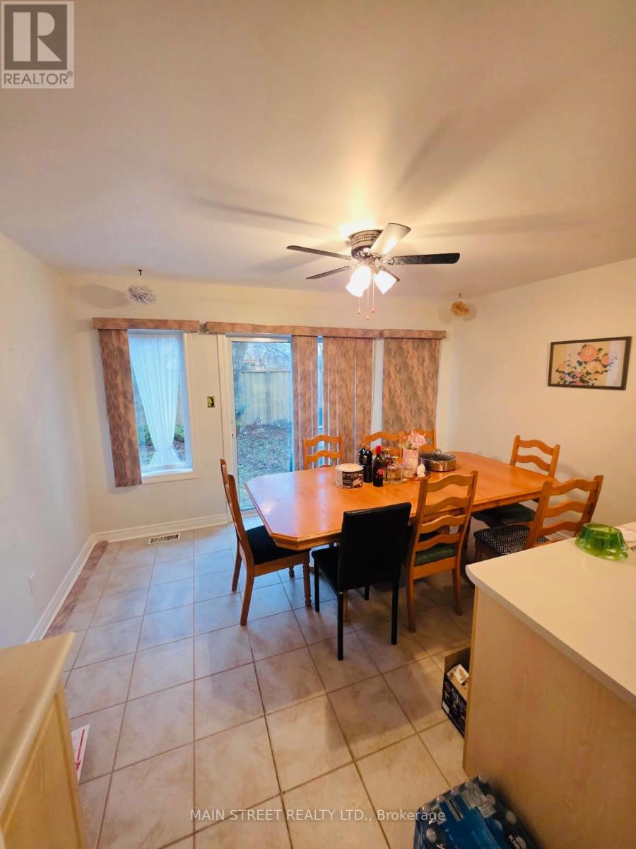 A dining room with a table set for six.