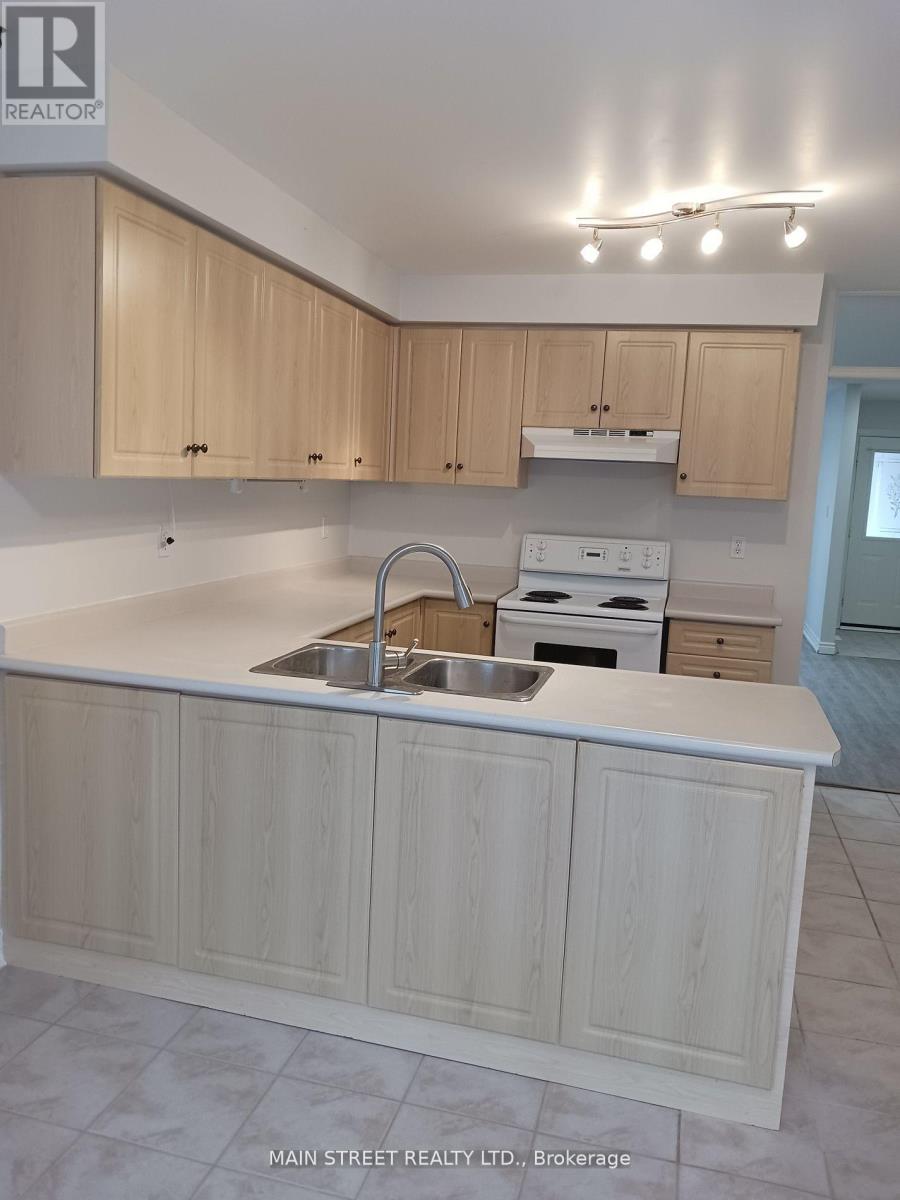 A kitchen with wooden cabinets and a white countertop.