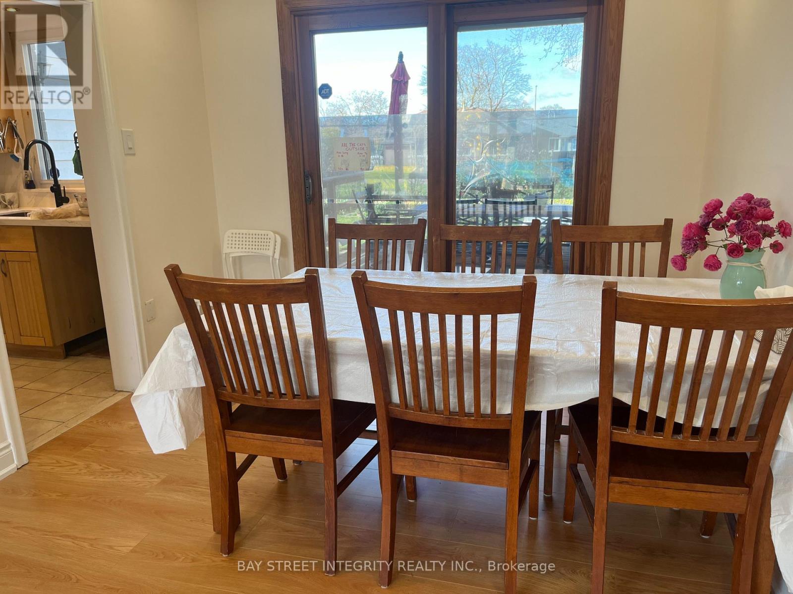 A dining room with a table set for four.