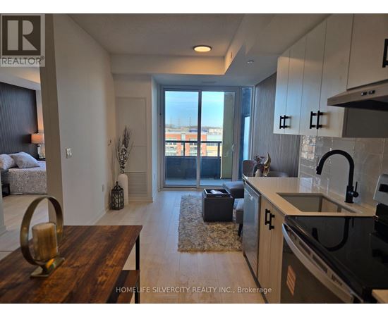 A modern kitchen with a wooden table and a view of the city.