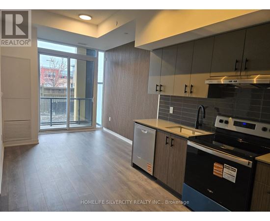 A kitchen with a black dishwasher and a black oven.
