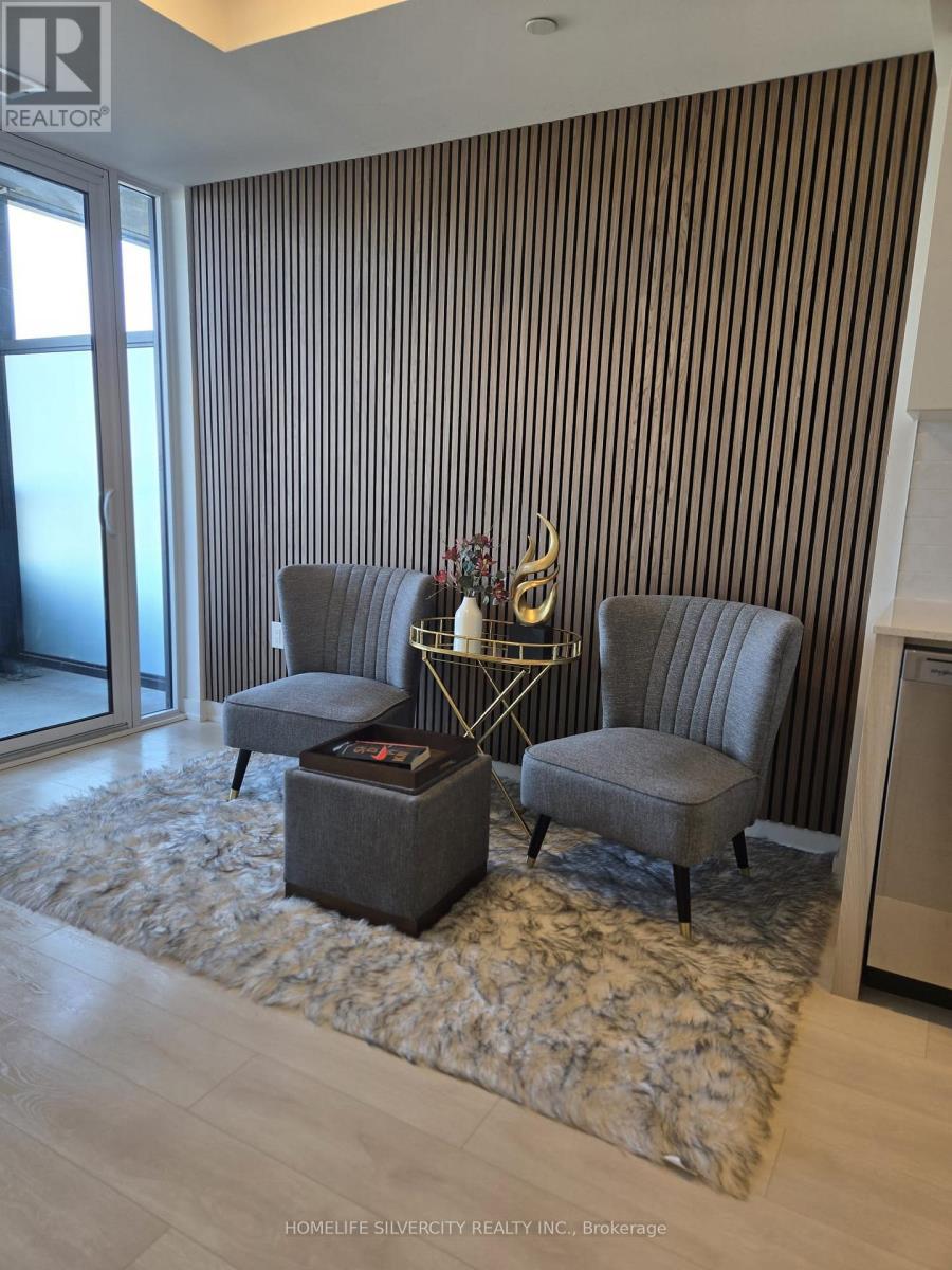A living room with a grey sofa and a coffee table.