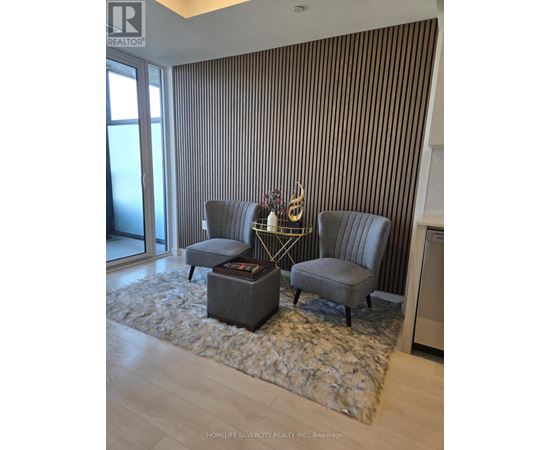 A living room with a grey sofa and a coffee table.