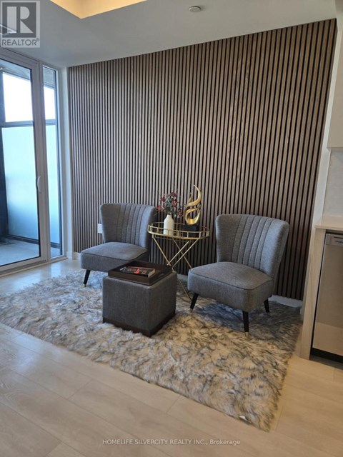 A living room with a grey sofa and a coffee table.