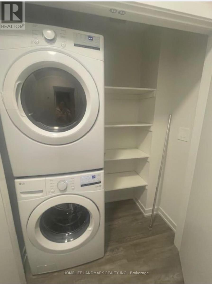A white washing machine and dryer in a small laundry room.