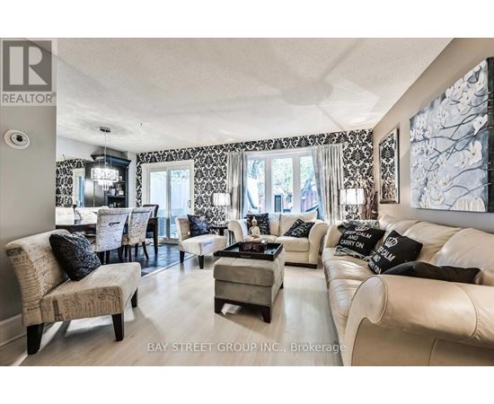 A living room with a white couch and a coffee table.