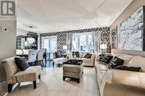 A living room with a white couch and a coffee table.