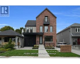 A house with a brick facade and a black door is for sale.