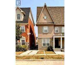 A house with a brown roof and a white door.