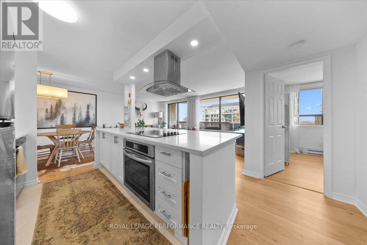 A well-lit kitchen with a dining table and chairs.
