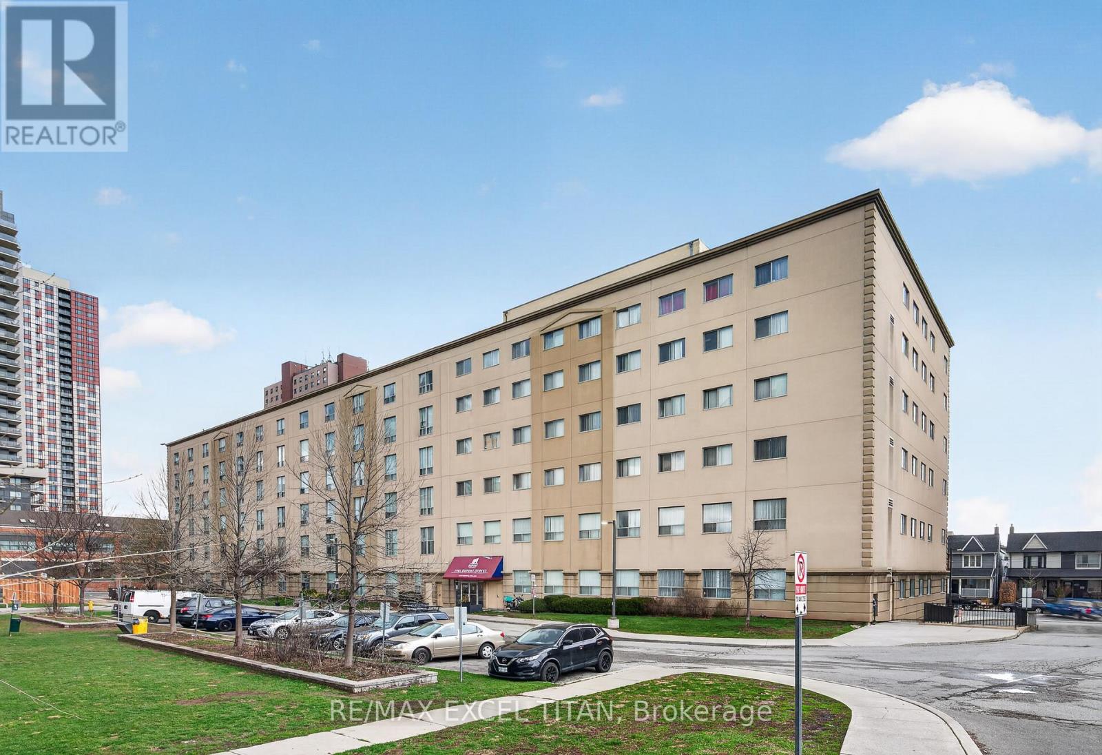 A large building with a parking lot in front of it.