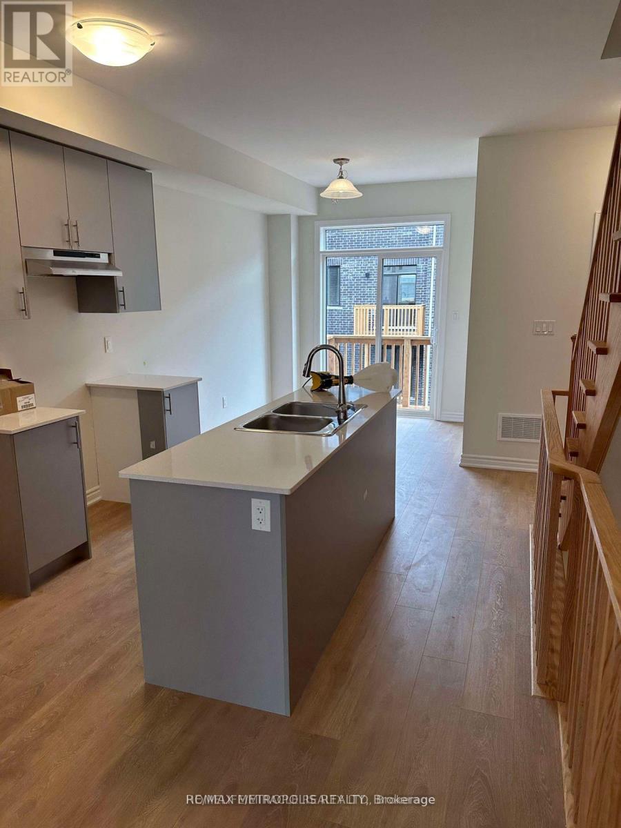 A kitchen with a sink and a window.