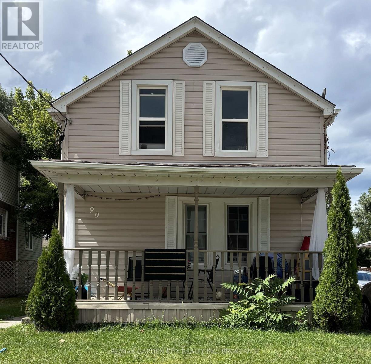 A house with a porch and a white door.