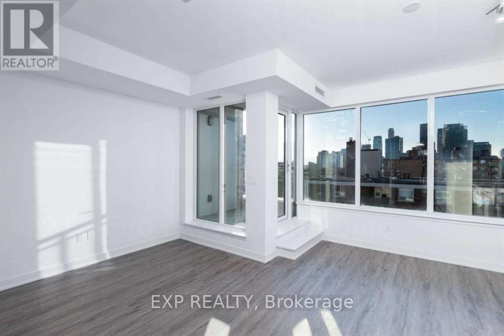 A room with a view of the city through the windows.
