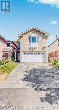 A house with a garage is for sale in Max Rouge River Realty.