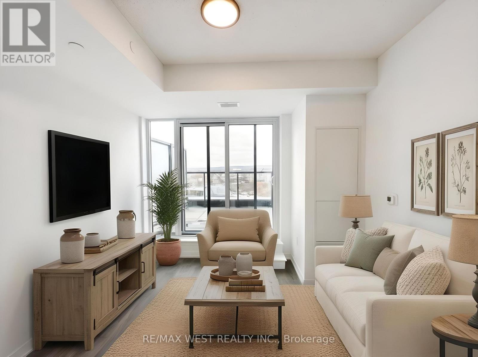 A living room with a flat screen TV mounted on the wall.