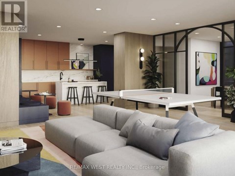 A modern living room with a grey sofa and a coffee table.