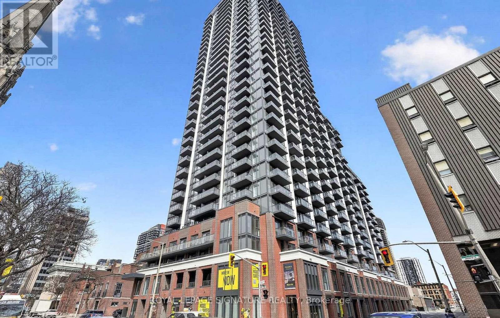 A tall building with a zigzag pattern is in the center of the image.