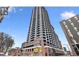 A tall building with a zigzag pattern is in the center of the image.