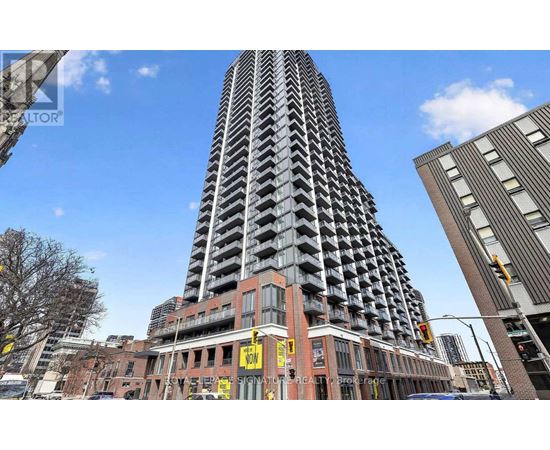 A tall building with a zigzag pattern is in the center of the image.