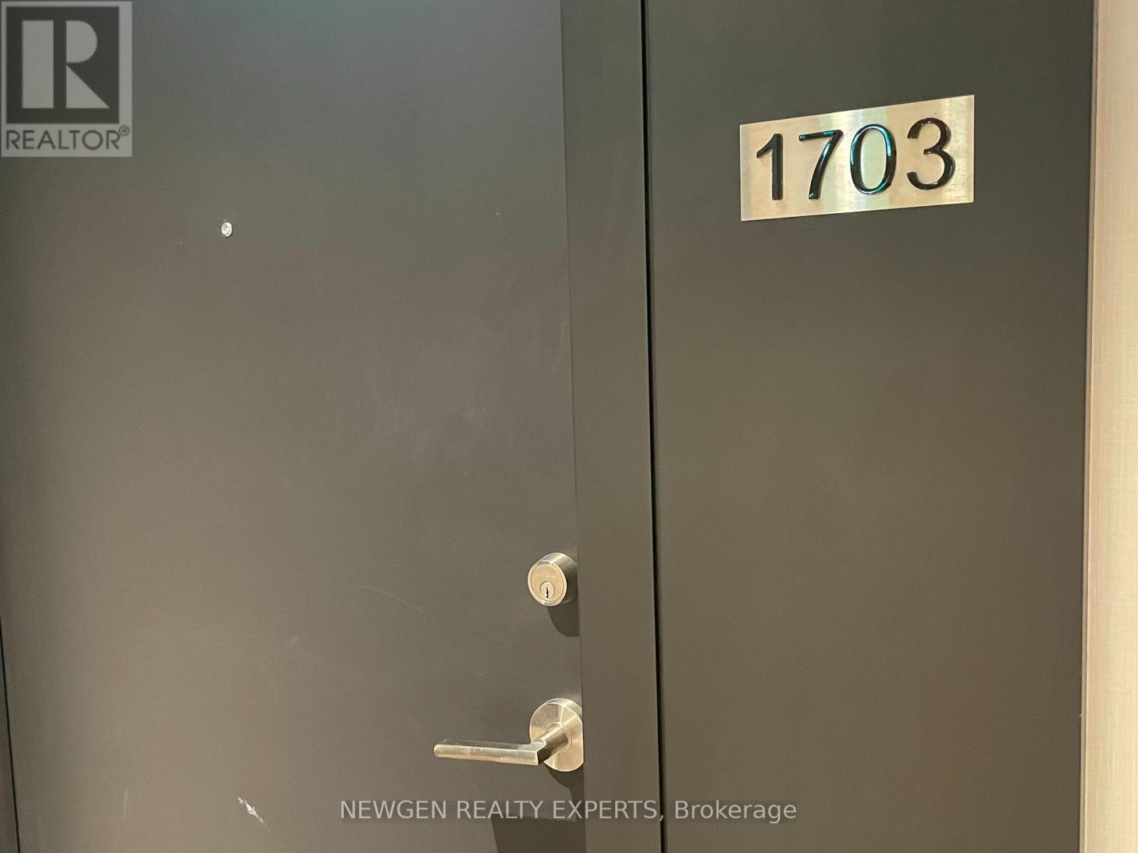A door with a number 1703 on it.