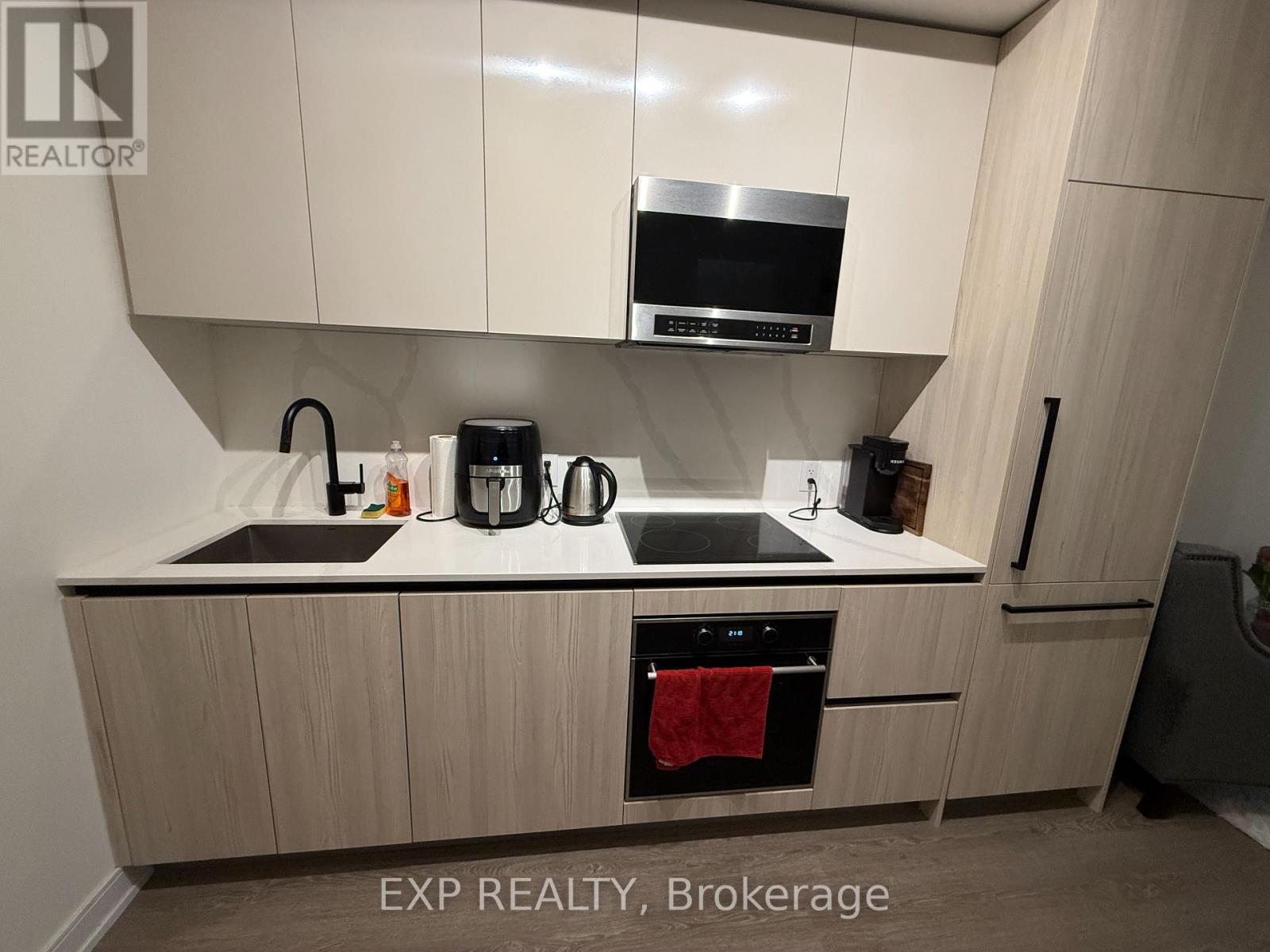 A kitchen with EXP REALTY, Brokerage watermark.
