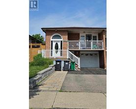 A house with a white door and a balcony is for sale.