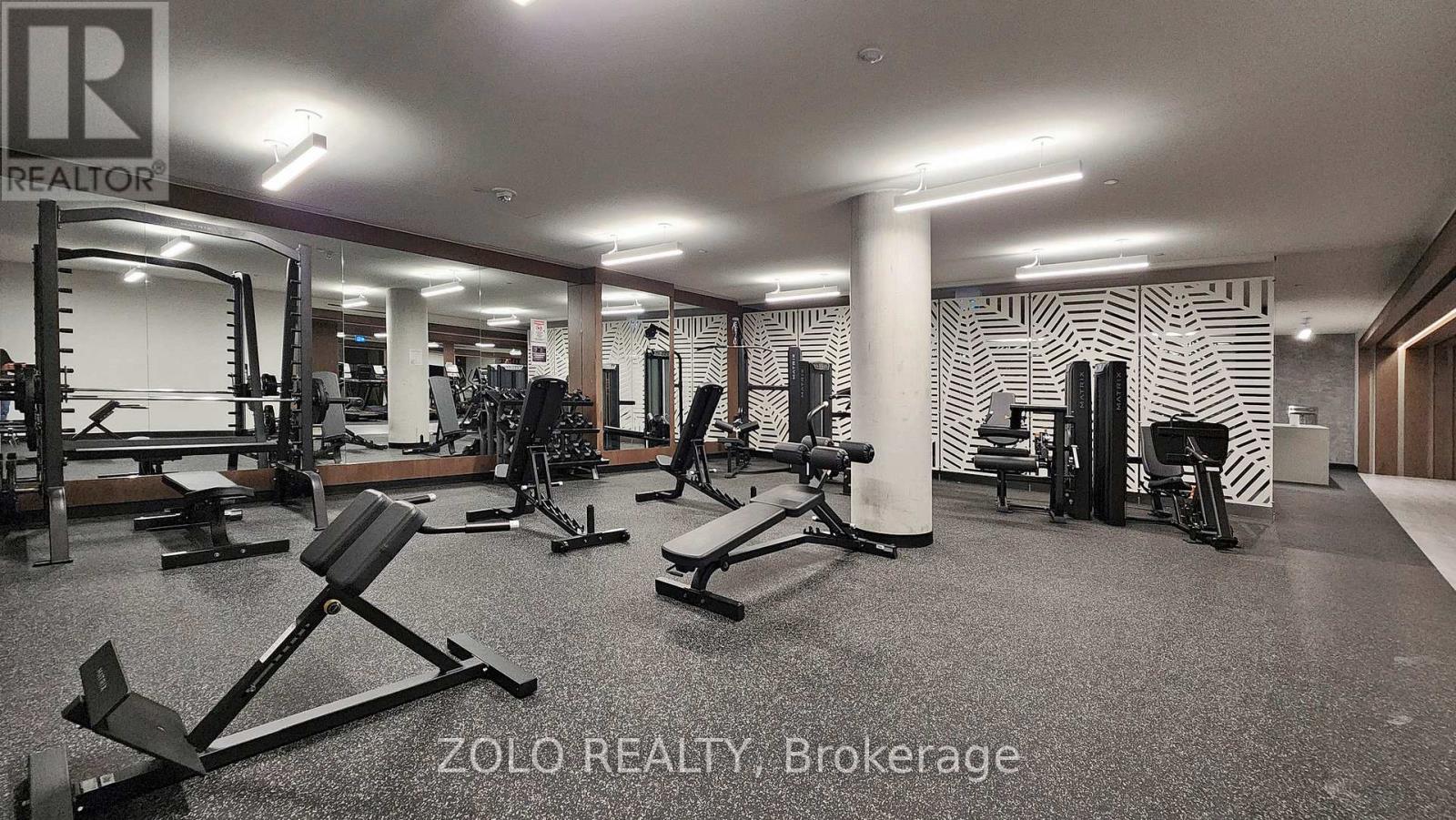 A gym with a variety of equipment is labeled ZOLO REALTY, Brokerage.