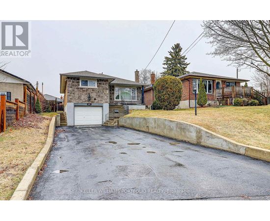 A house with a driveway in front of it.