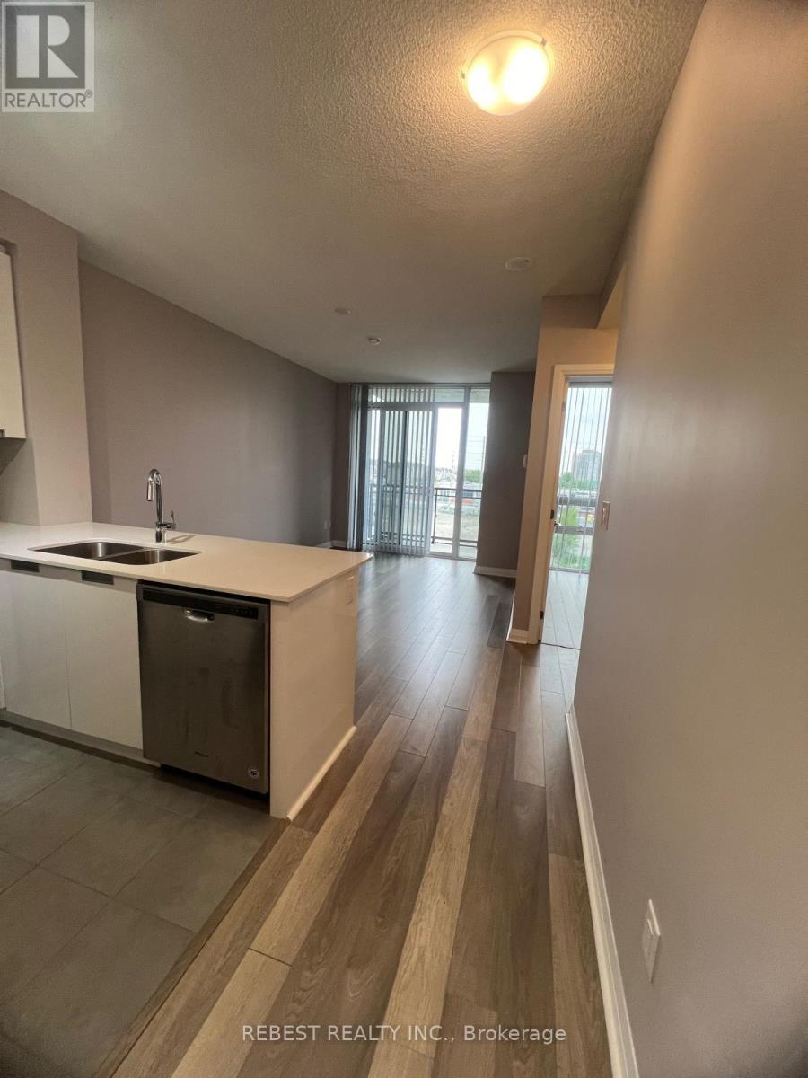A kitchen with a sink and a counter.