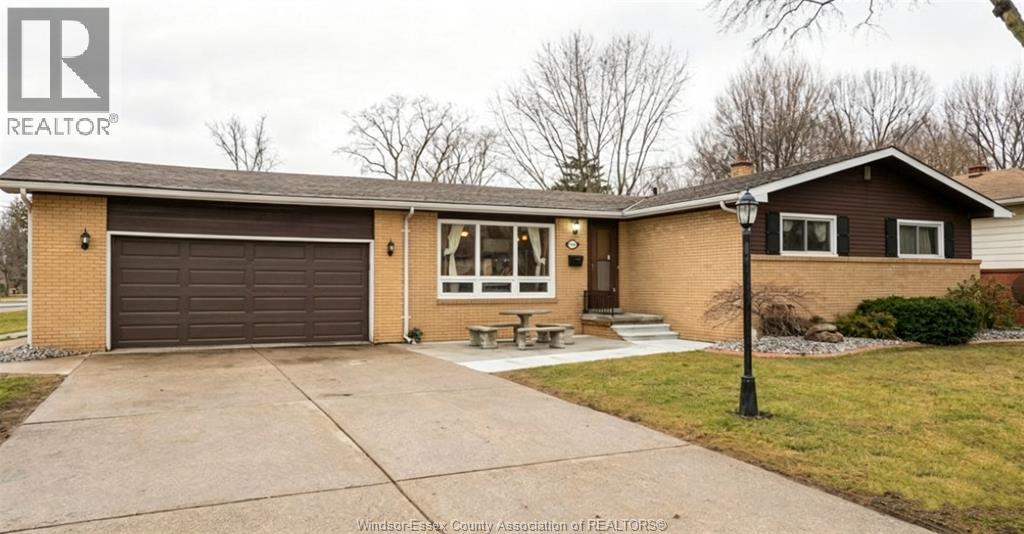 A house with a brown garage door is for sale.