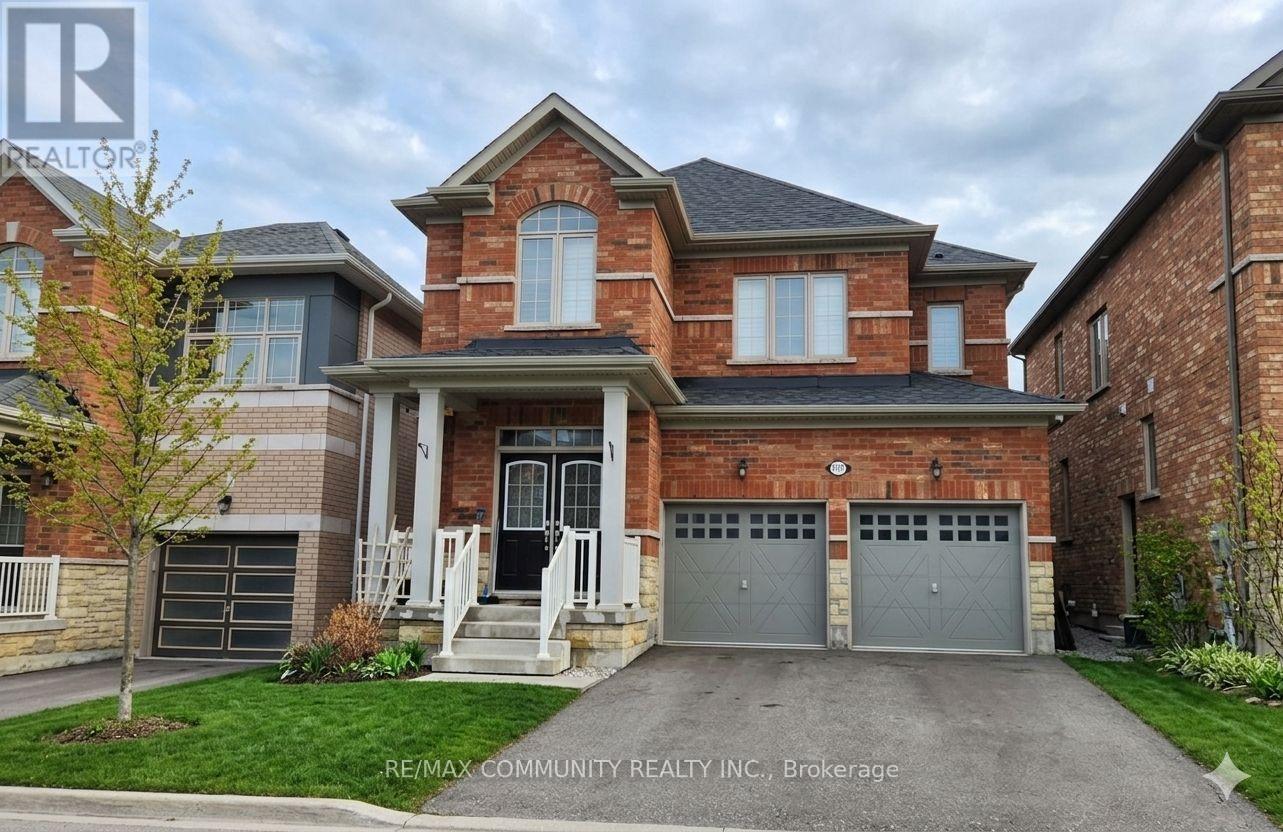 A large brick house with a garage is for sale.