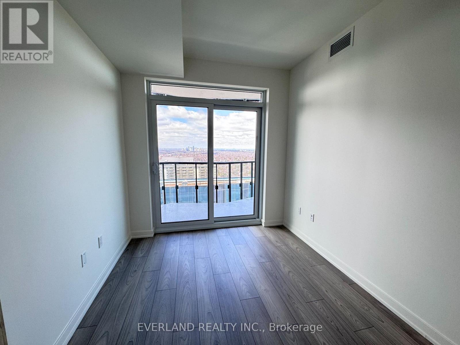 A room with Everland Realty Inc. logo on the wall.
