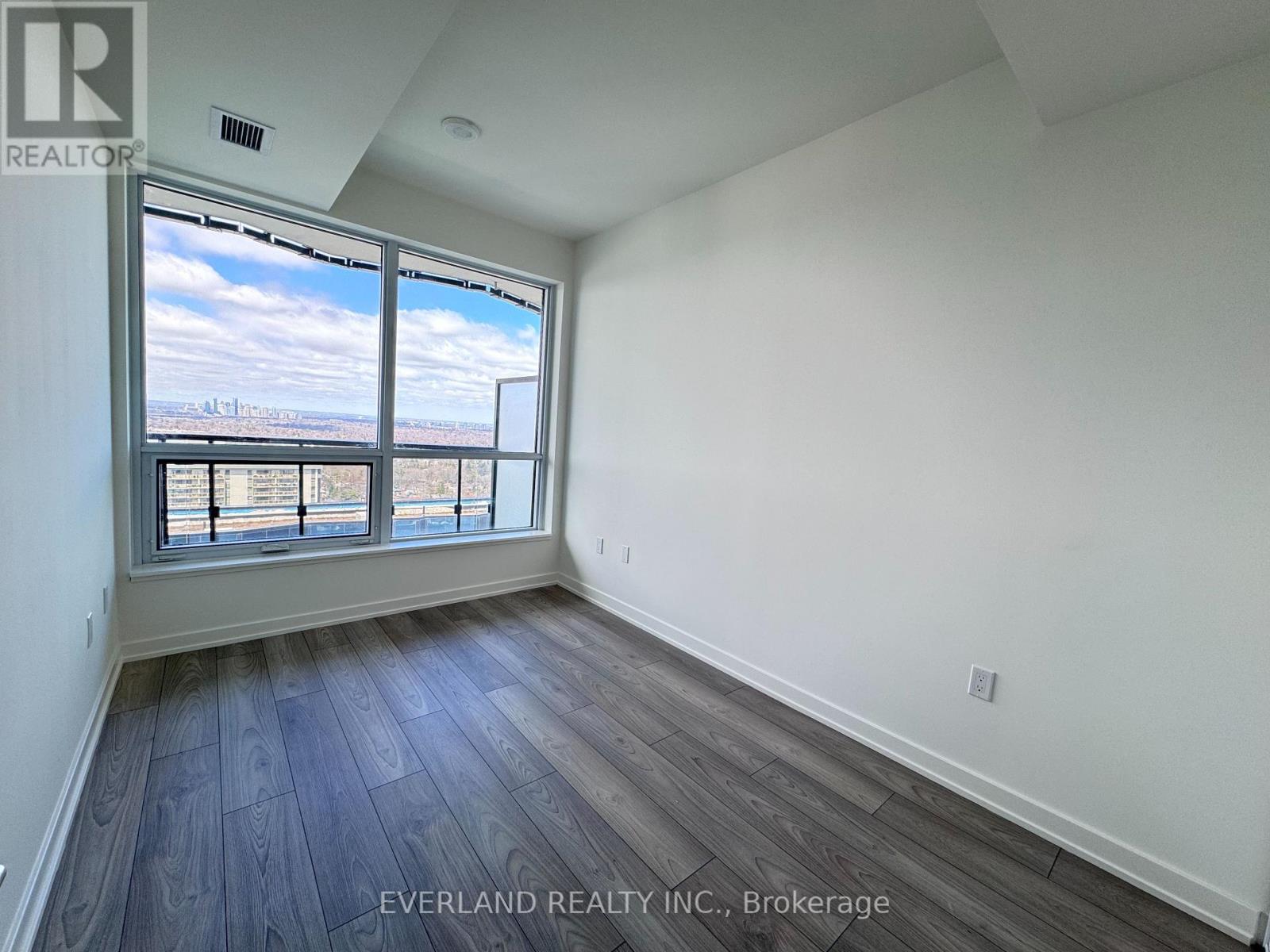 A room with Everland Realty Inc. logo on the wall.