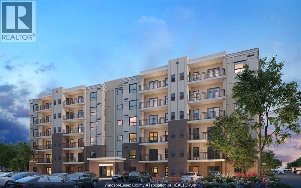 A modern apartment building with a parking lot in front.