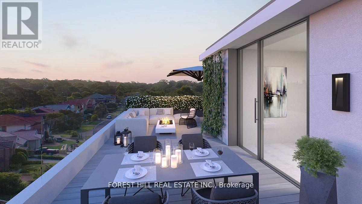 A modern outdoor dining area with a table set for four.