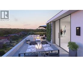 A modern outdoor dining area with a table set for four.