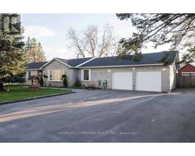 A two-story house with a garage is shown in the image.