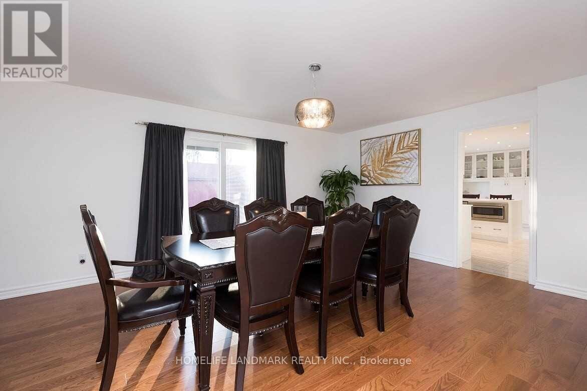 A dining room with a table set for six.