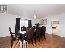 A dining room with a table set for six.