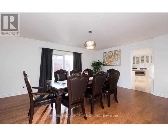A dining room with a table set for six.