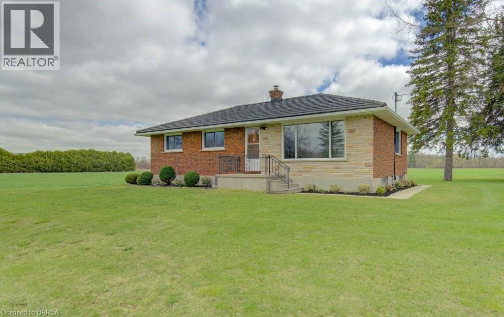 A house with a lawn in front of it.
