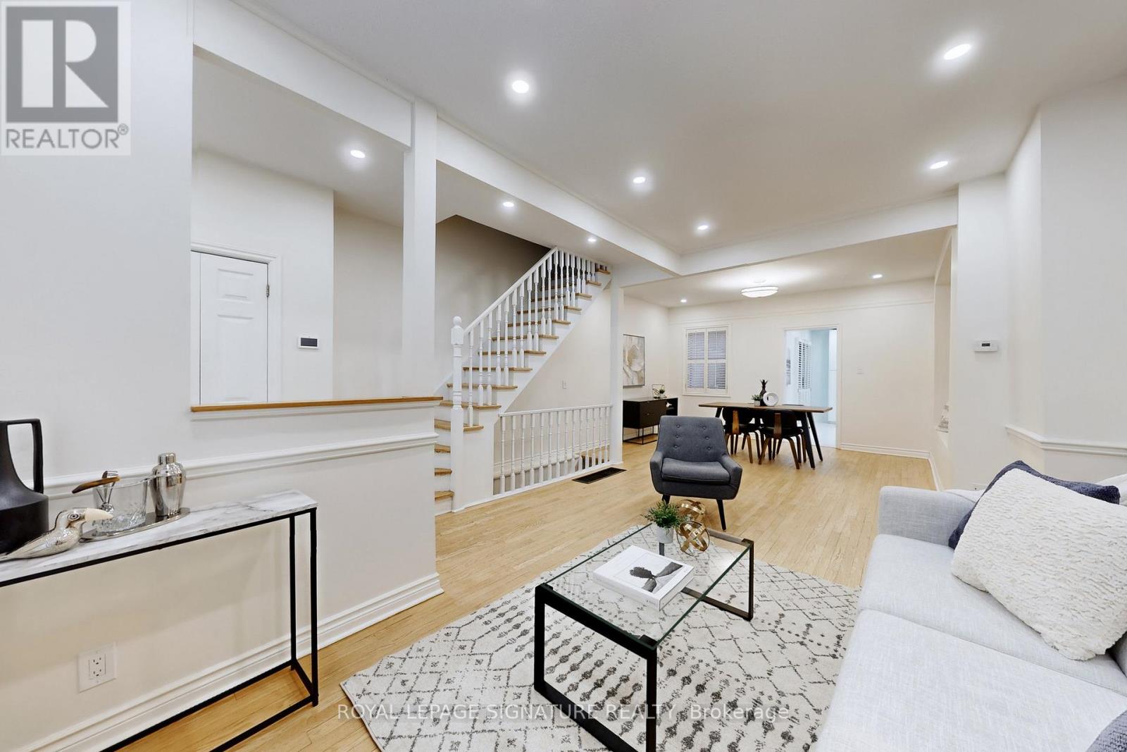 A living room with a couch, chair, and coffee table.