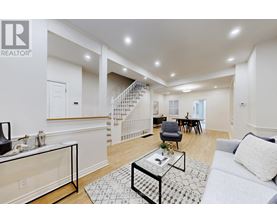 A living room with a couch, chair, and coffee table.